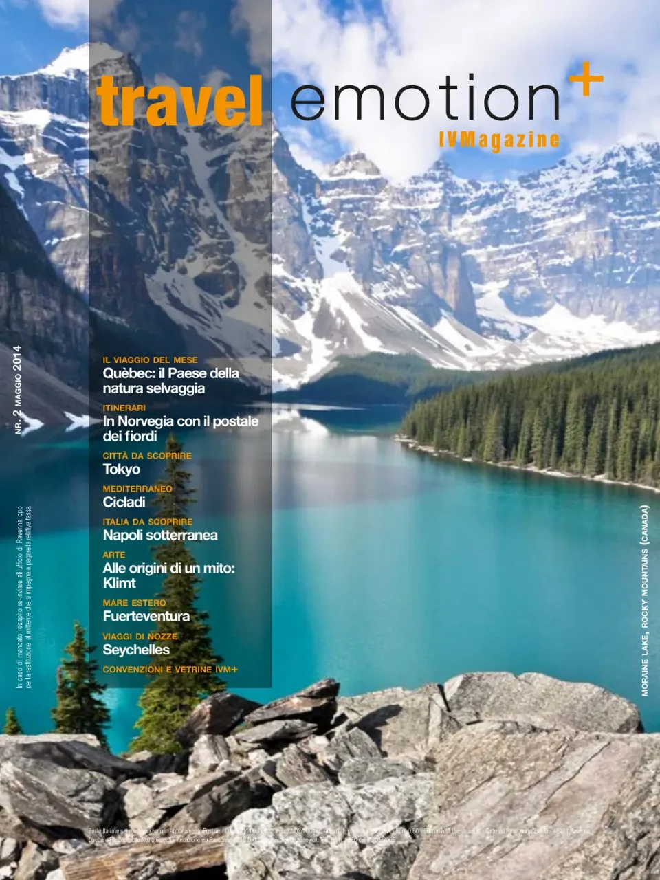 Copertina di Travel Emotion+, numero 2 di maggio 2014: un lago tra le montagne innevate del Canada, con la testata e i titoli del numero